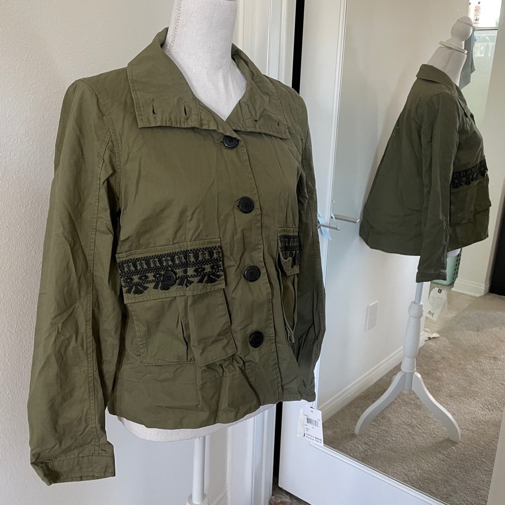 Army green jacket with black embroidered pockets